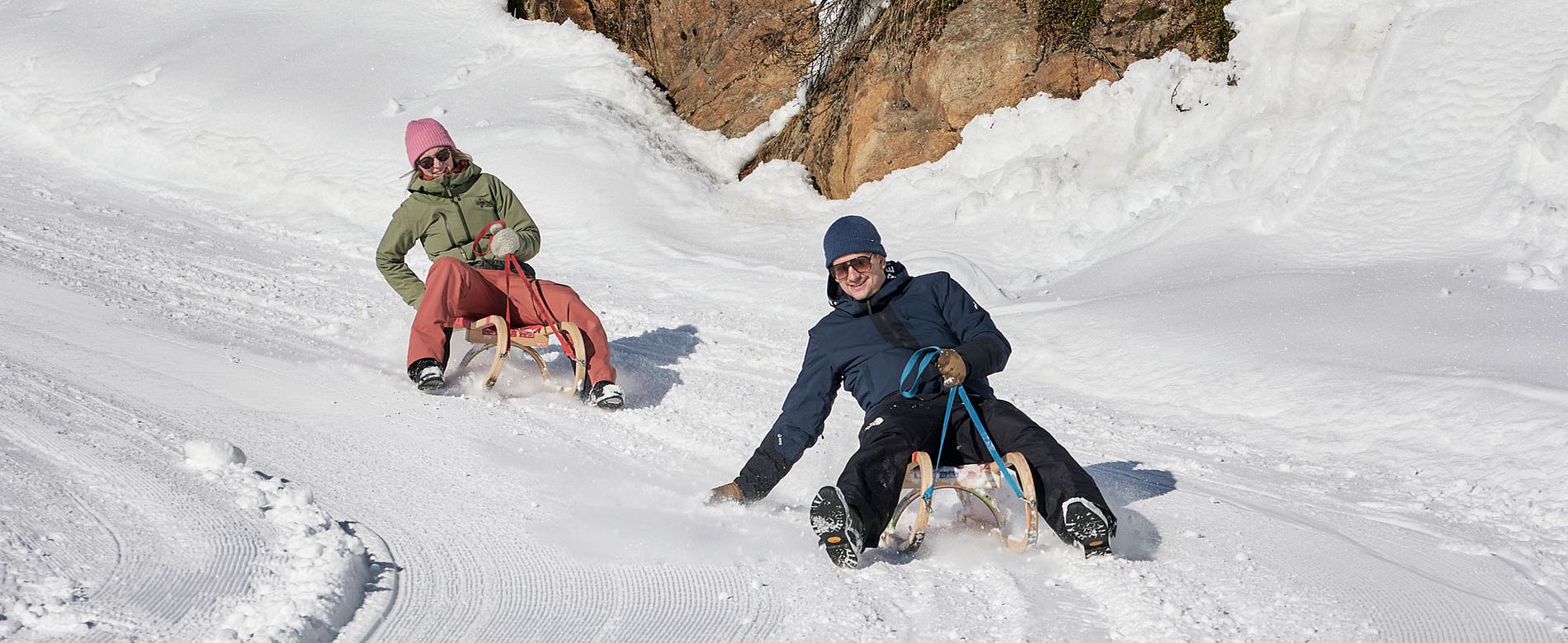 Fun and action on the snow Tobogganing